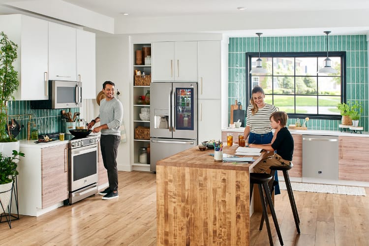 family in a kitchen with LG smart appliances